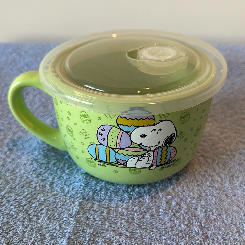 Peanuts soup container, or oversized coffee cup.